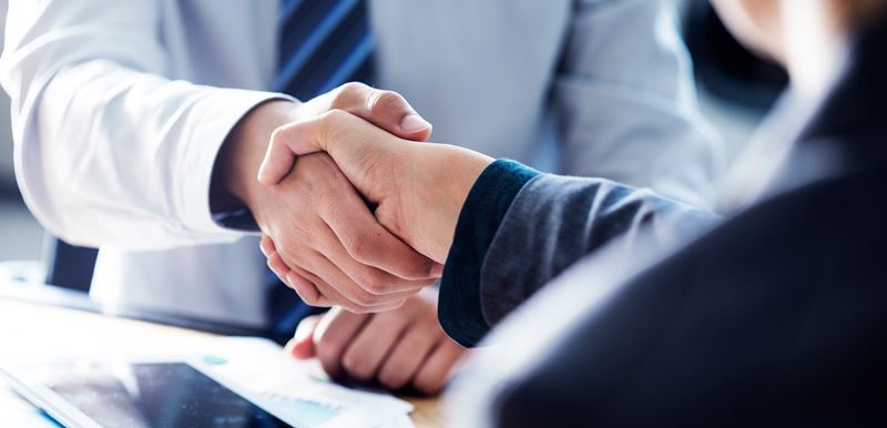two people shaking hands
